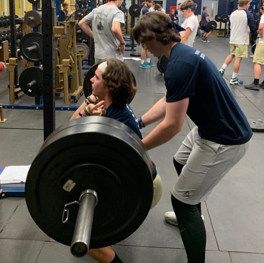 Tyler+Monk+lifting+for+the+40%2F40+challenge+while+being+spotted+by+Wes+Ward