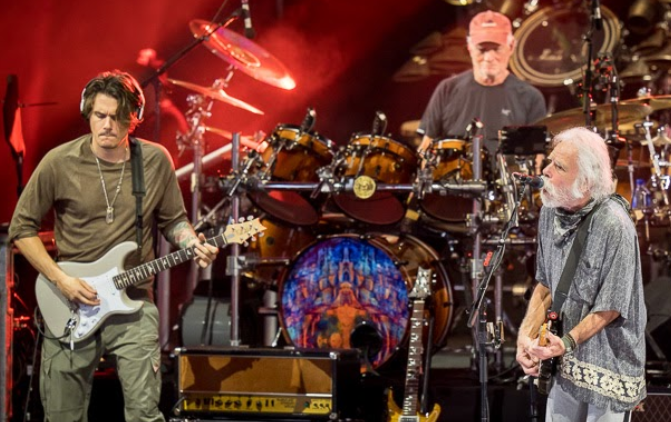 Dead and Company playing, John Mayer left, Bill Kreutzman middle, and Bob Weir right. Courtesy of citybeat.com.