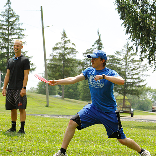 Resident Assistant (RA) on Disc Golf course at Ohio Christian University. Photo courtesy of OCU Disc Golf Website.