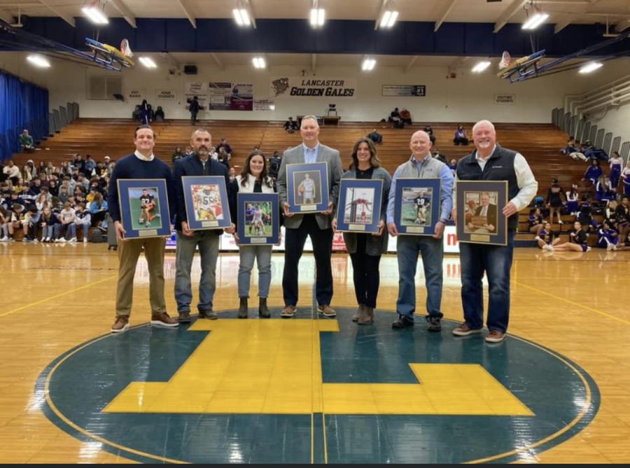 Bryan Bowdish, Billy Burke, Erica Campbell Goss, Greg Cave, Alysha Gossel Curry, Steve Poston, and Jack Greathouse holding their Athletic Wall of Honor frames. Photo courtesy of LHS Facebook.