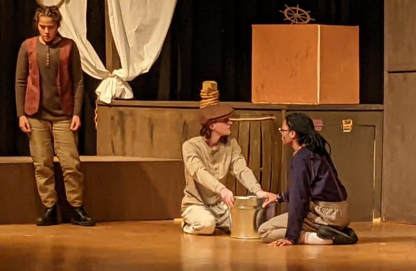 Cast members rehearse a scene in the play, Peter and the Starcatcher.