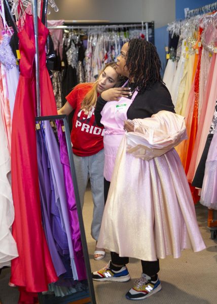 A student shops for a free prom dress. Photo courtesy of Fairy Goodmothers.
