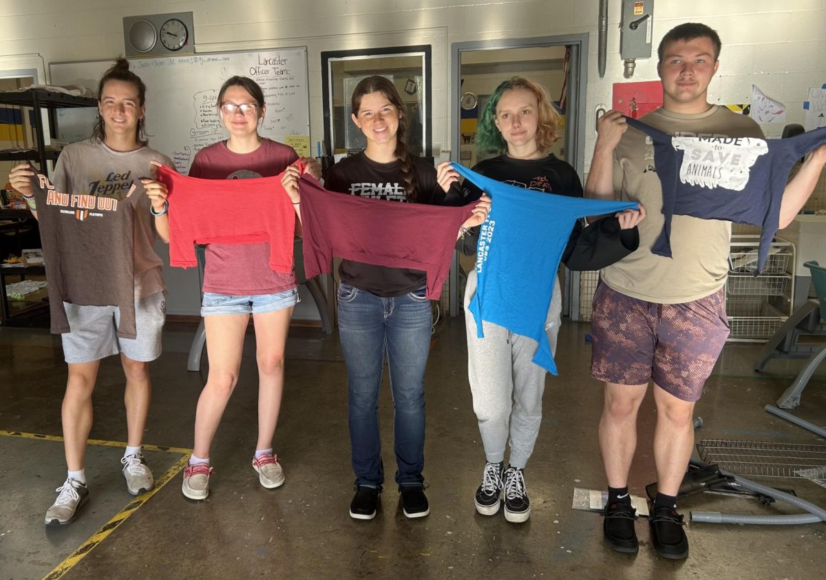 LHS Animal Science students show their hand-made squirrel hammocks.