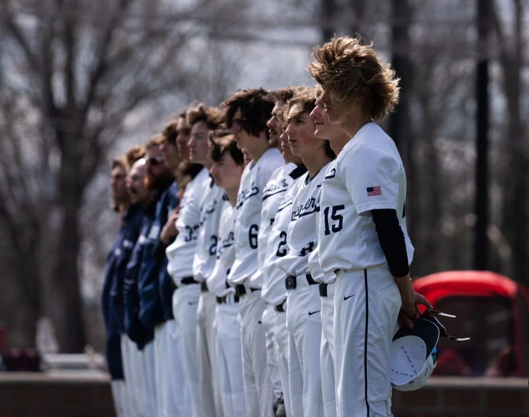 The Lancaster High School Baseball team standing for flag etiquette. 
Photo courtesy of Imagical Studios LLC. 

