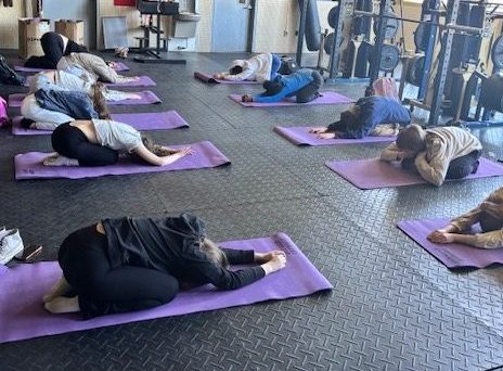 Students practice yoga during class. Photo courtesy of Chevalier.
