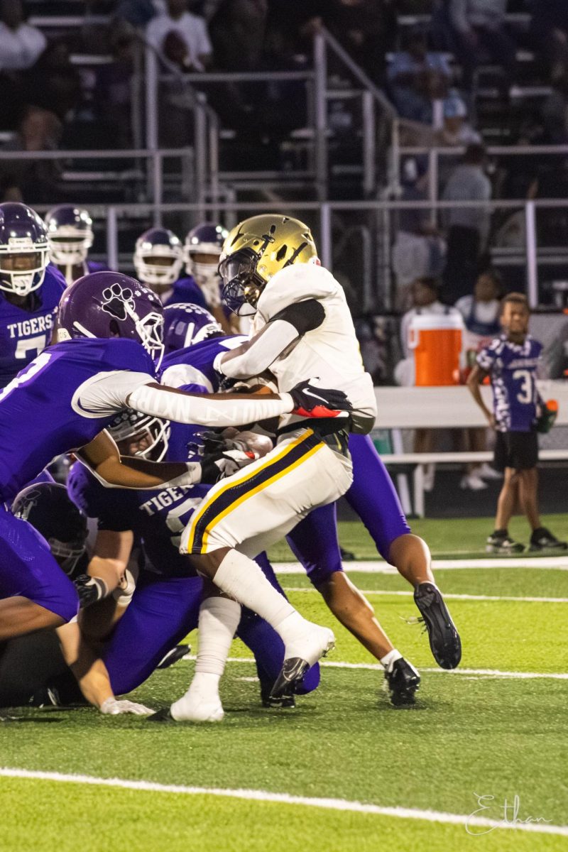 LHS running back Jahmeir Gordon struggles to run the ball against Pickerington Central in week six.   Photo courtesy of Ethan Edwards.
