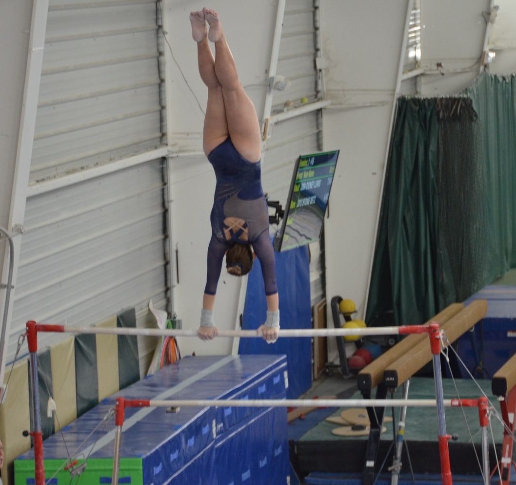 LHS senior Lexie Lape on the uneven bars in a meet. Photo courtesy of Lape.
