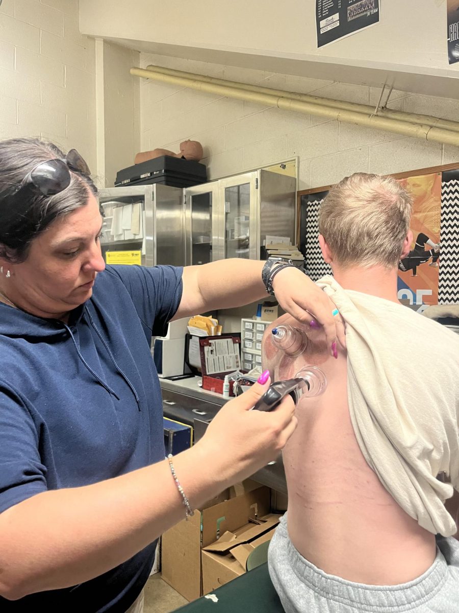 LHS athletic trainer Leigh Spring works with a student athlete.
